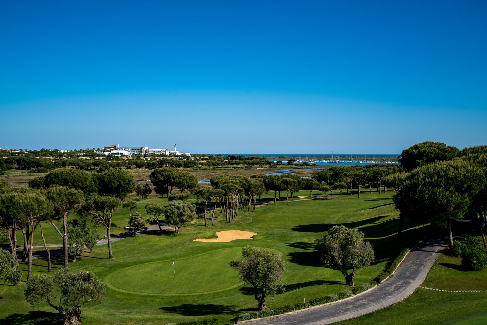 El Rompido golf course, with the resort and marina in the distance